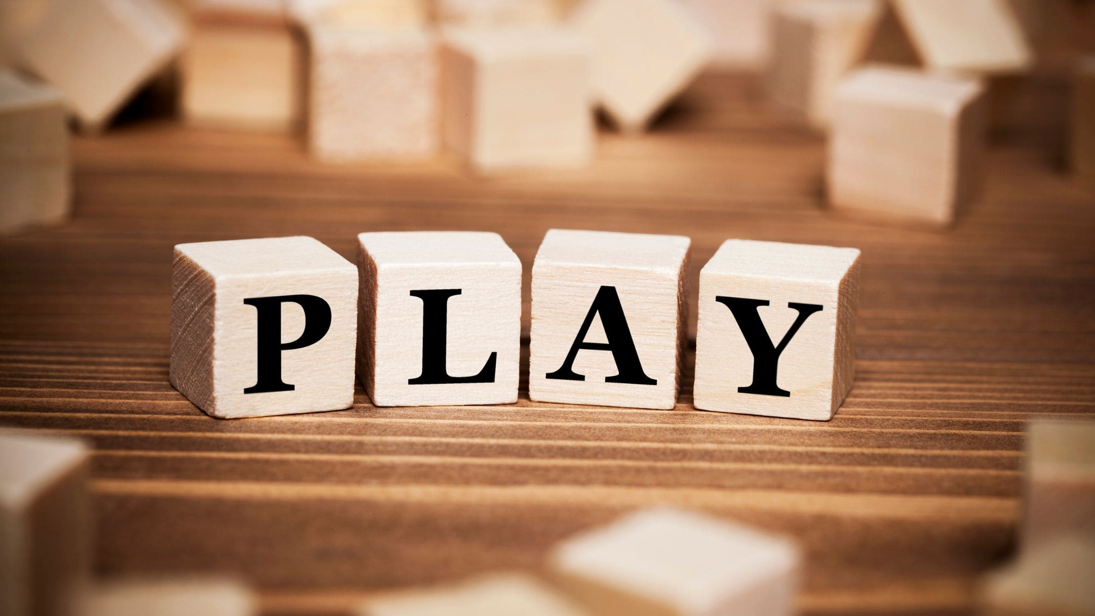 cubes spelling out PLAY