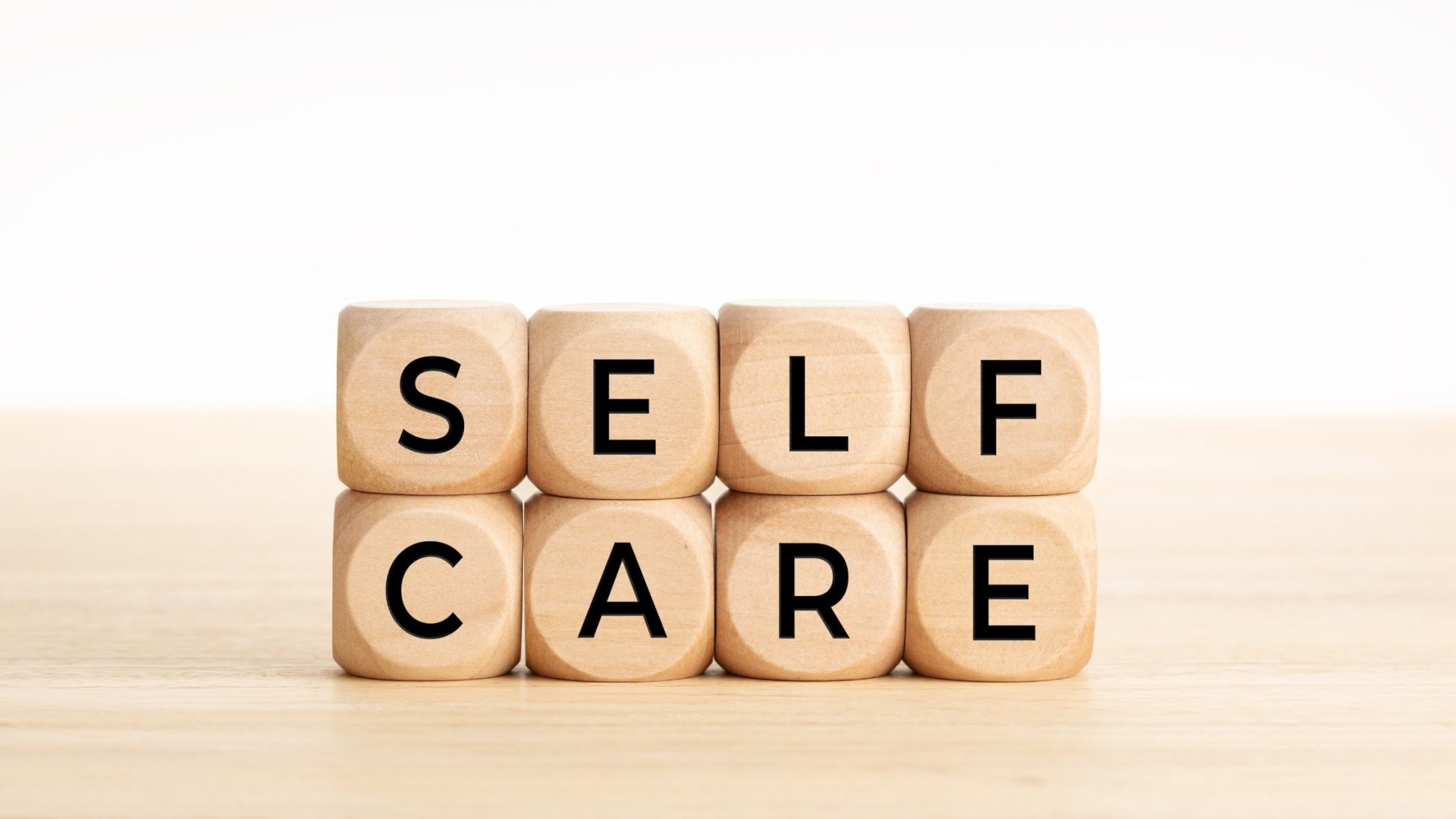 cubes spelling out self care